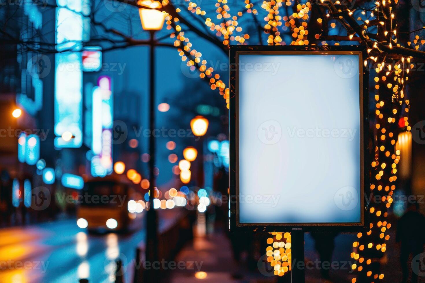 An empty billboard on a city street at night photo
