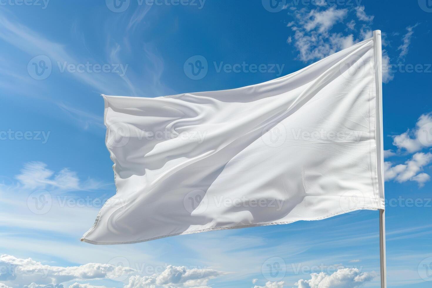 White flag on blue sky background photo