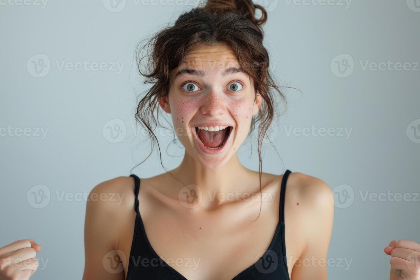 A woman is making a surprised face photo