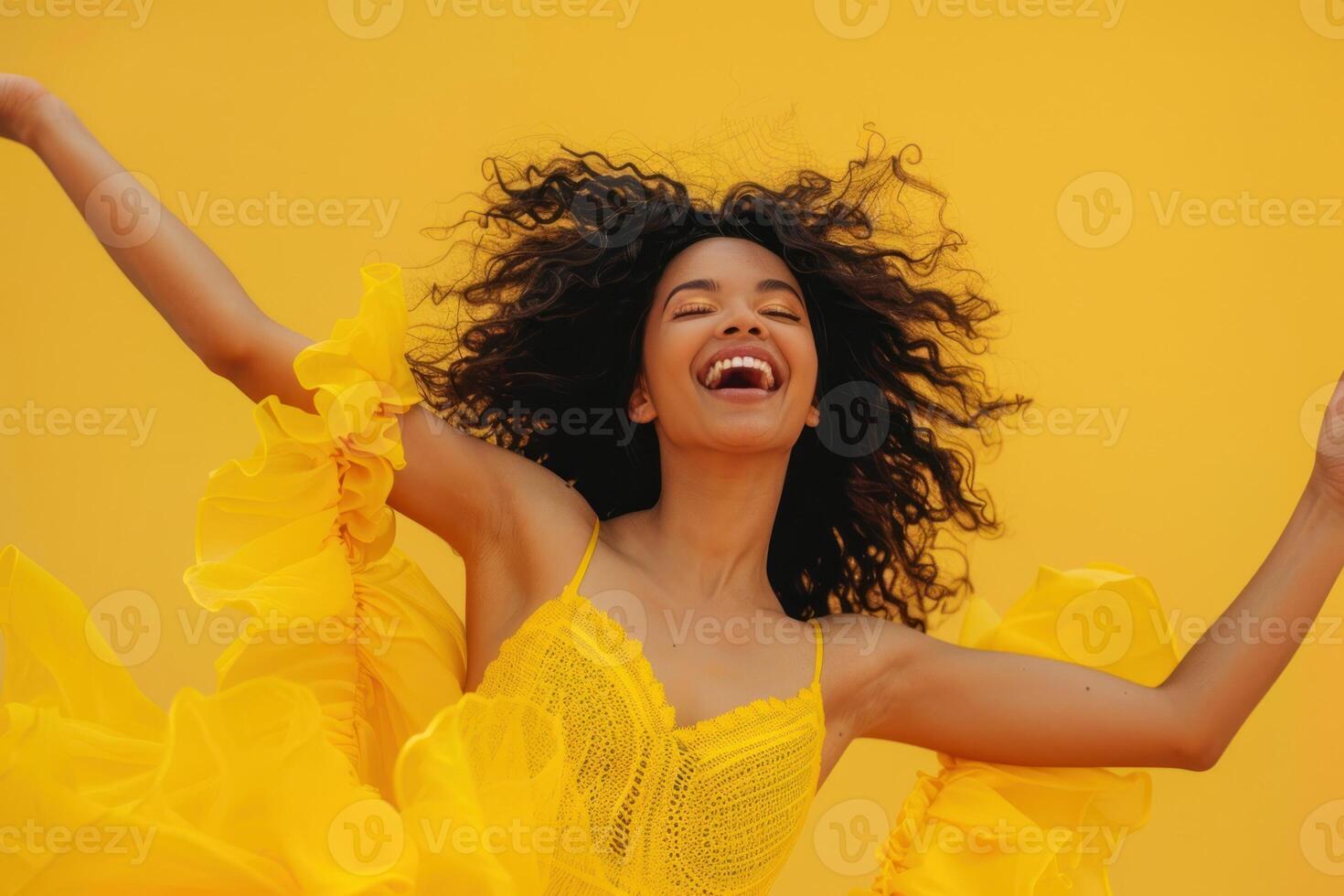 A woman in a yellow dress is laughing photo