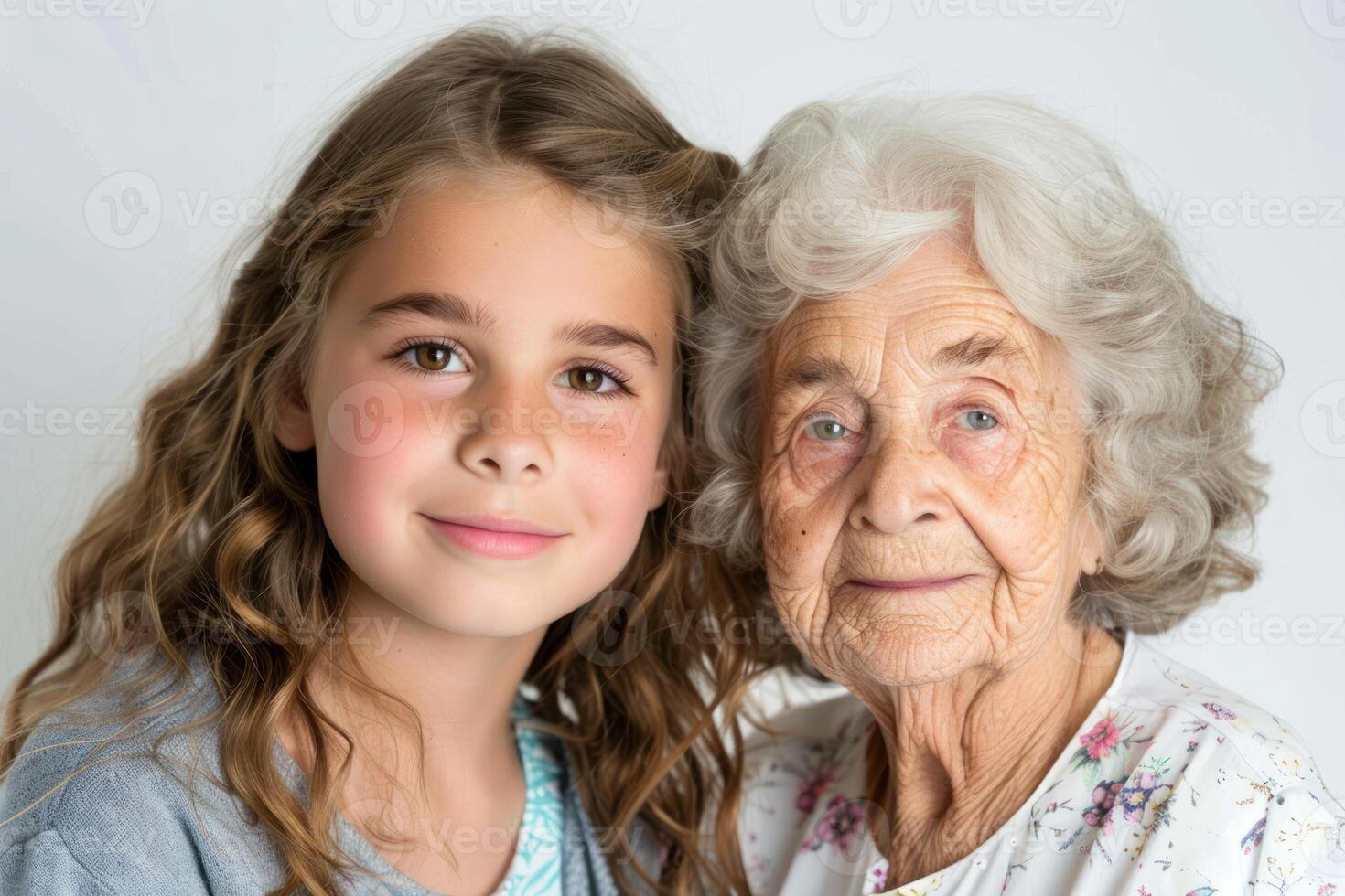 A young girl and an older woman posing for a photo