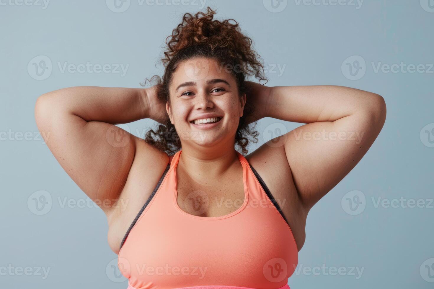 A woman in a sports bra top smiling photo