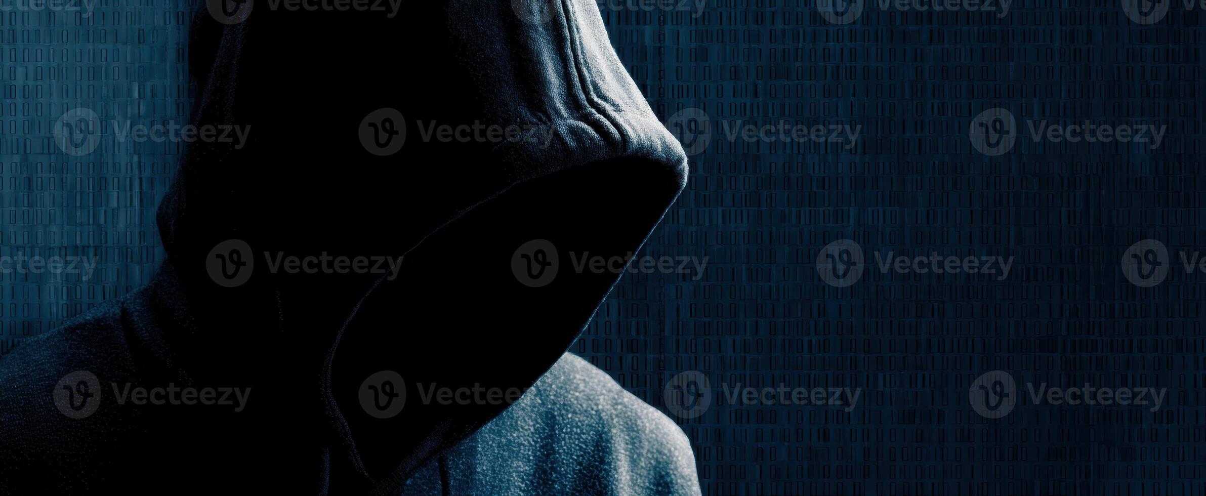 The mysterious hooded figure in a dark atmosphere conveying anonymity and intrigue. photo