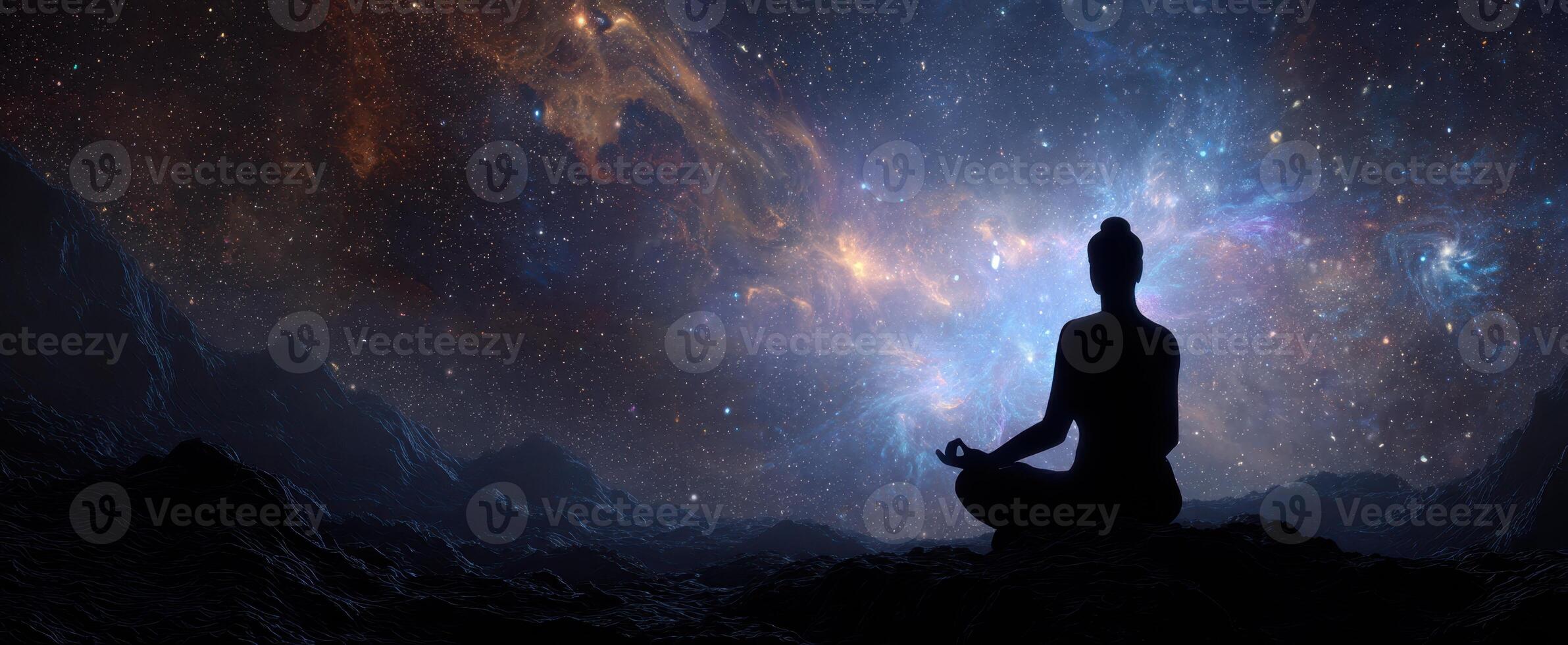 The Meditative Silhouette Under a Cosmic Galaxy Filled with Stars photo