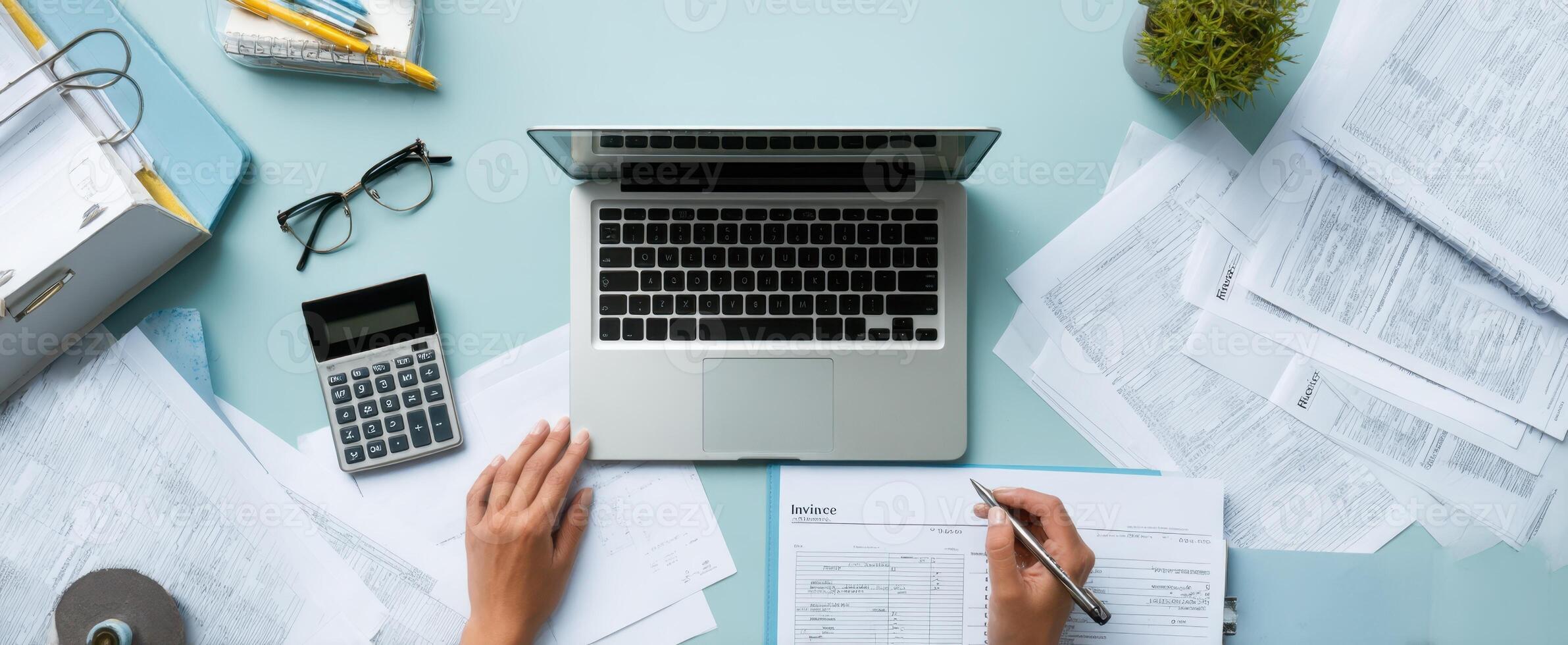 The laptop and documents on a modern office workspace for financial planning. photo