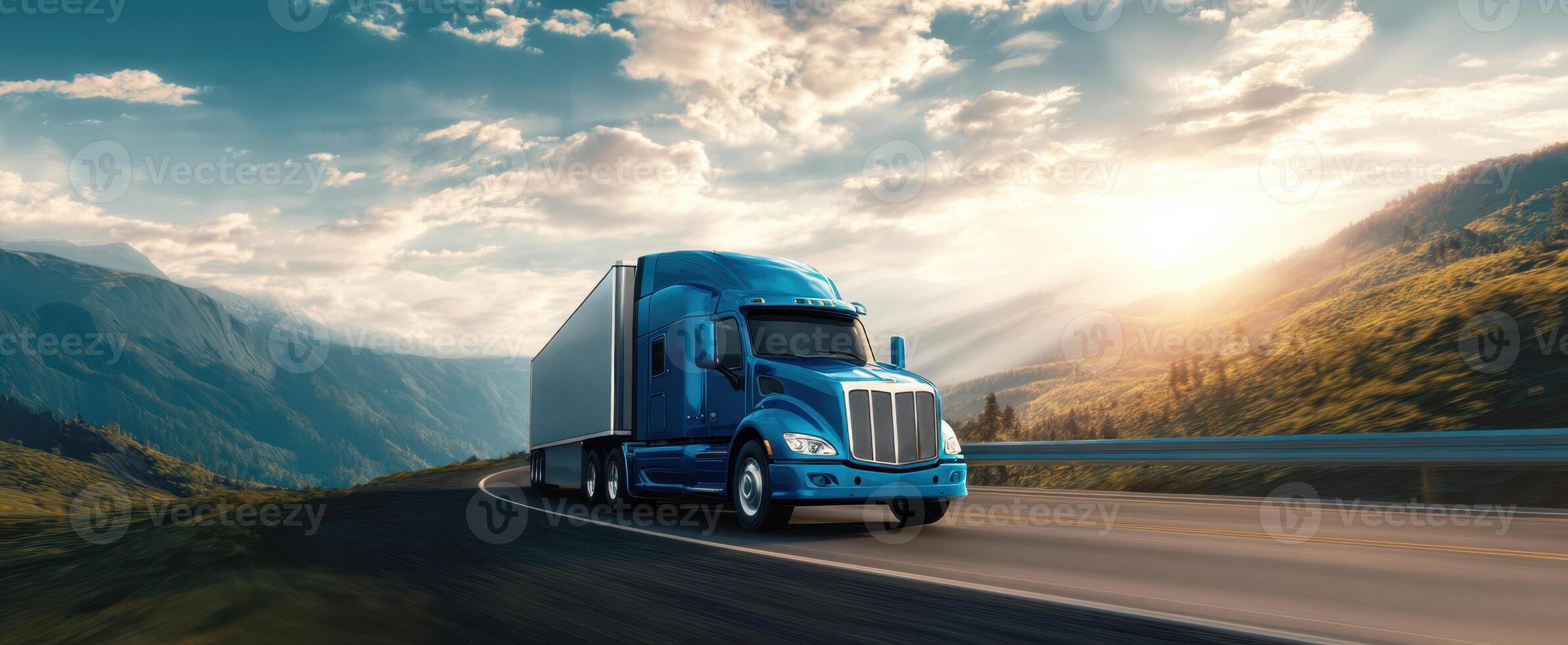 The bold blue truck cruising along a scenic mountain highway at sunset. photo