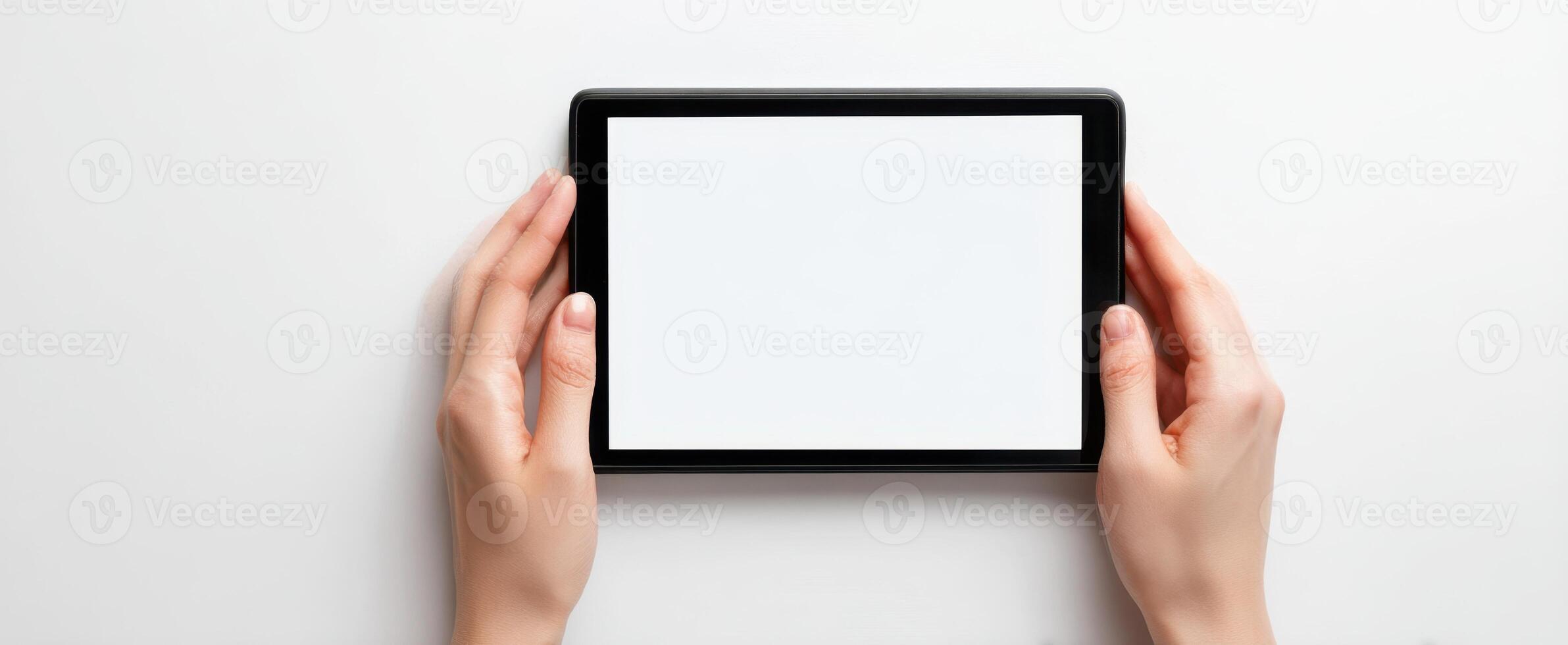 The tablet held in hands ready for creative design or mockup. photo