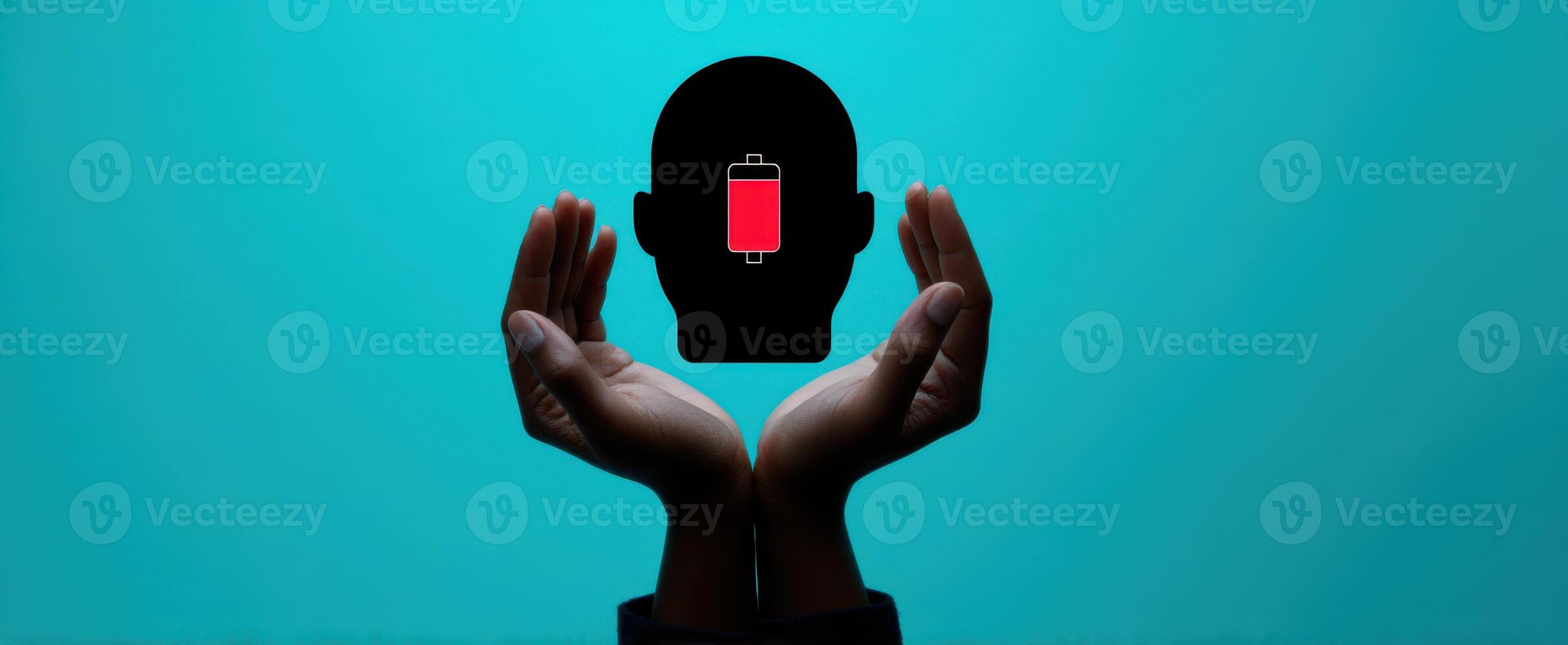 The silhouette of a head being recharged by supportive hands. photo