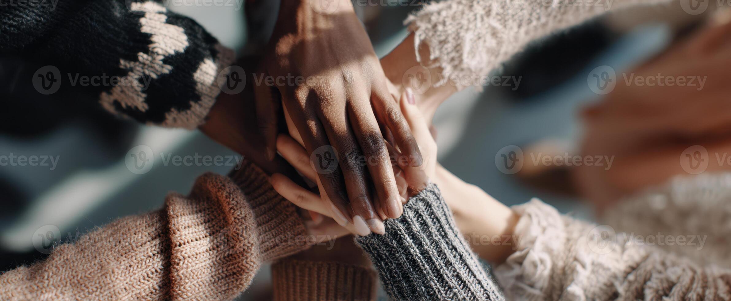 The hands of friendship coming together in a show of unity and support. photo