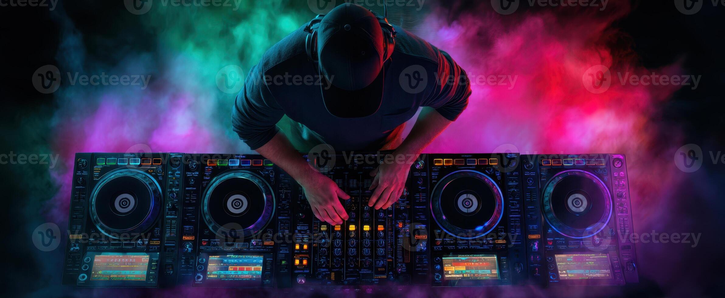 The DJ Creating Electric Vibes with Colorful Lights and Sound Effects photo