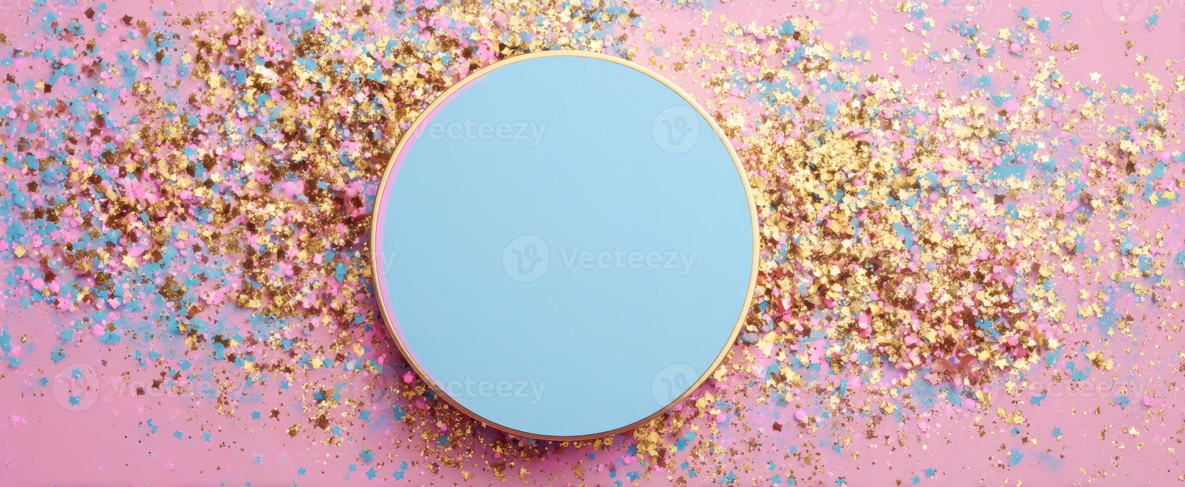 The round blue surface surrounded by colorful glitter sparkles on pink backdrop. photo