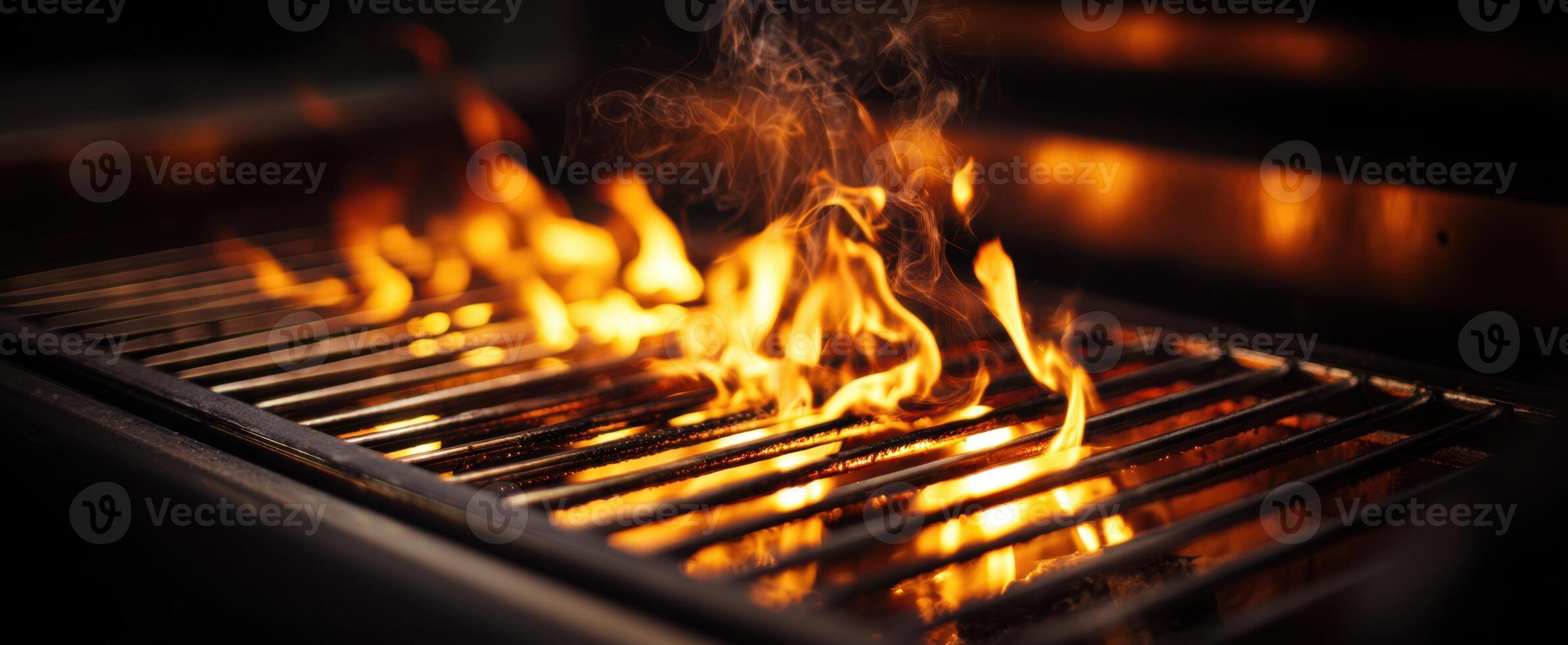 The glowing flames of a sizzling barbecue grill in action. photo