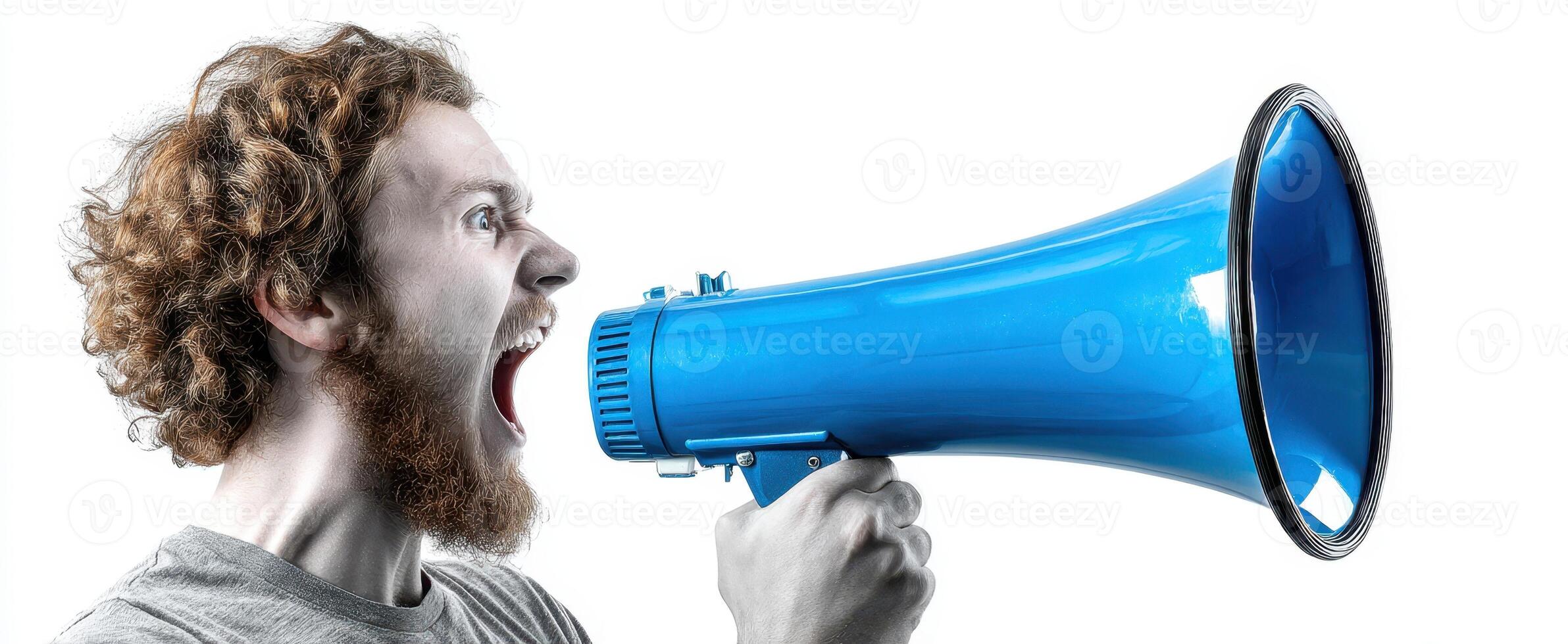 The man passionately shouting into a blue megaphone in a studio setting. photo