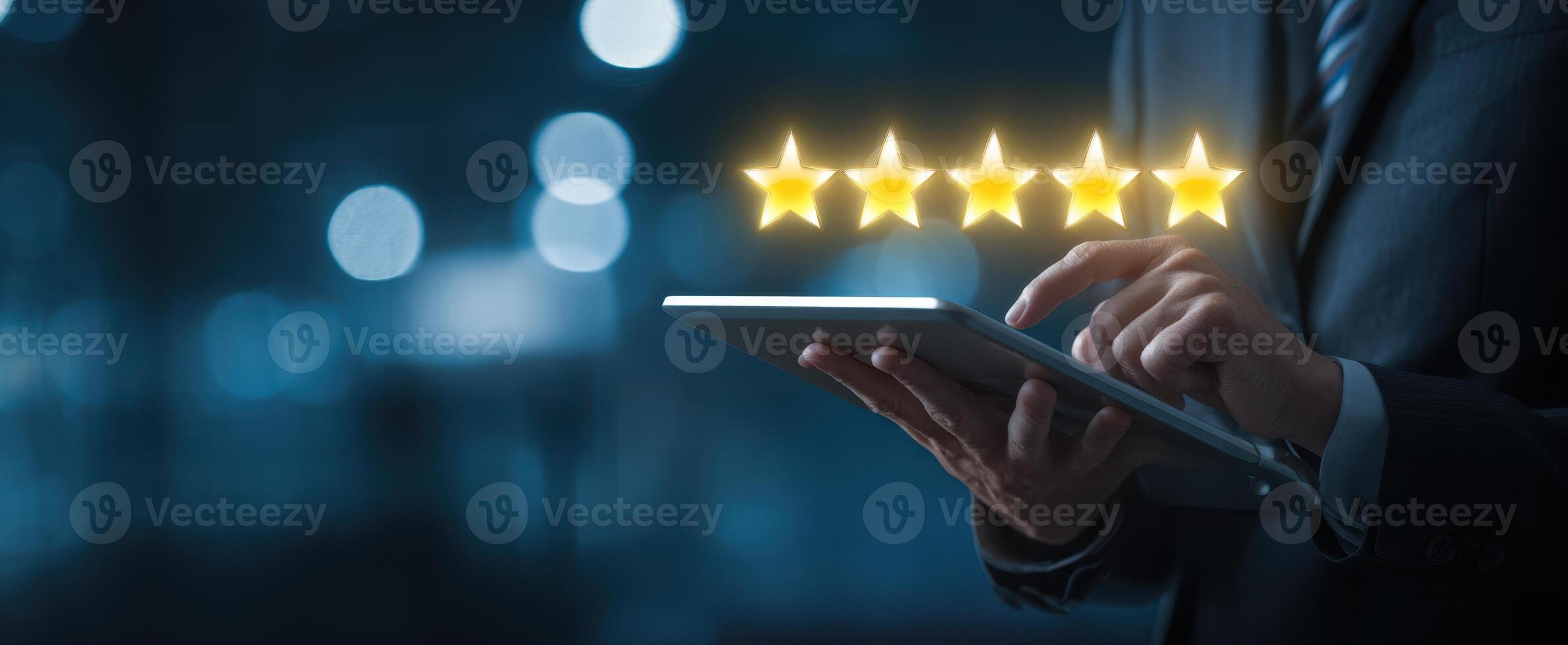 The businessman interacting with a tablet displaying five-star ratings and reviews. photo