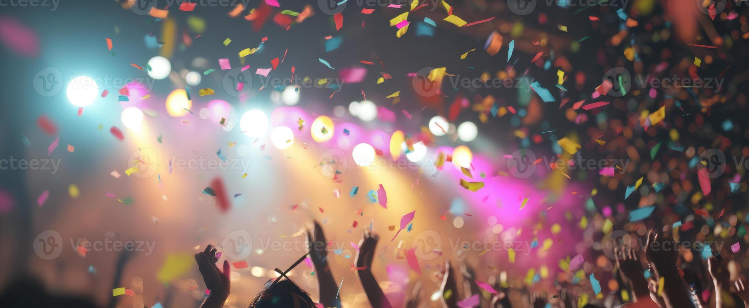 The vibrant celebration of music and joy with colorful confetti in the air. photo