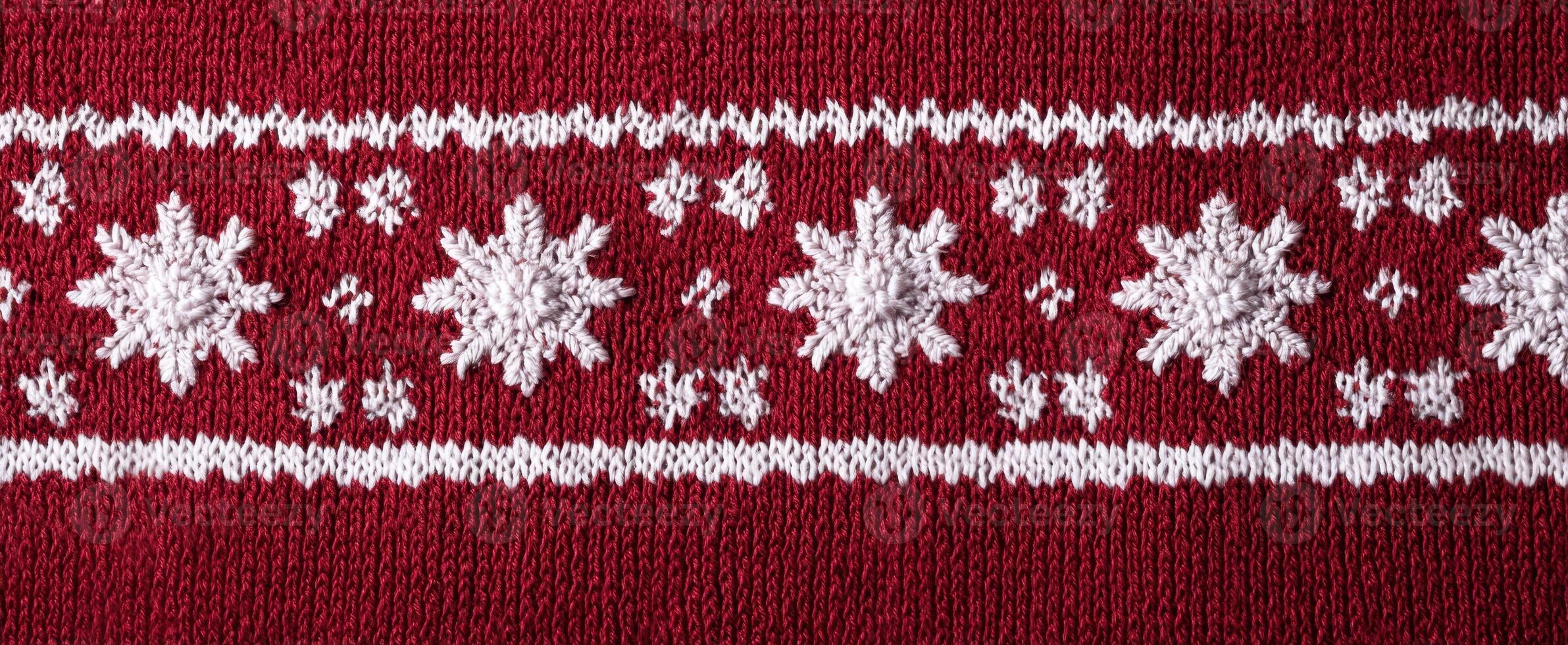 The Decorative Red Knitted Fabric with White Snowflake Patterns photo