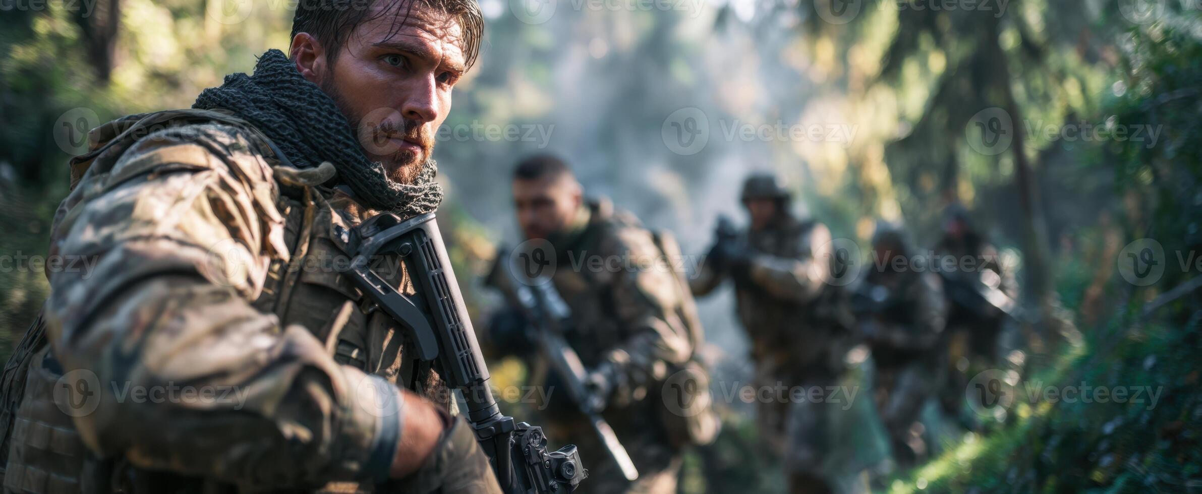 The soldier in camouflage leading a tactical team through a dense forest. photo