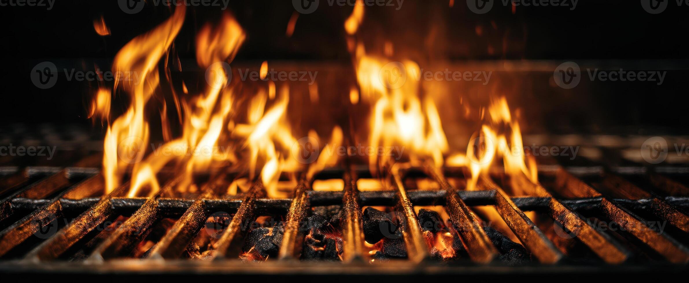 The mesmerizing flames dancing above a sizzling grill at sunset. photo