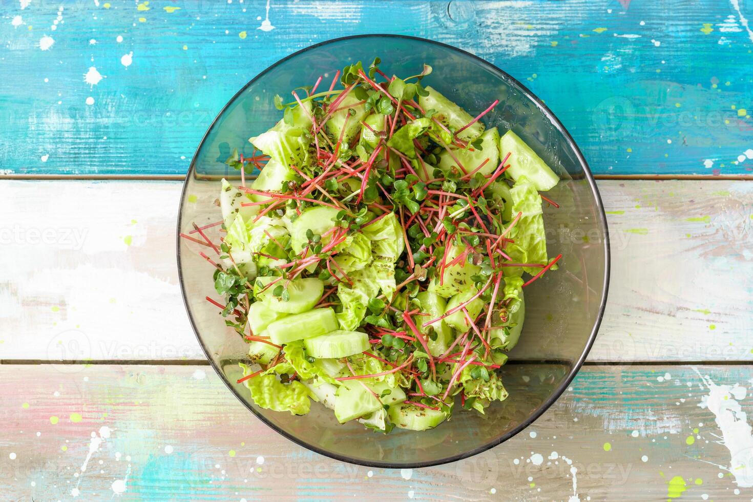 Fresh salad with red radish microgreens and vegetable mix. Healthy food and vegetarian lunch. Concept plant base diet for health lifestyle. photo