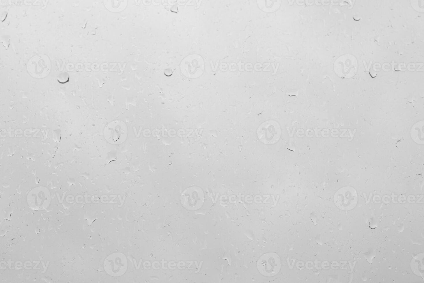 Rain drops on a window pane create a natural texture. photo