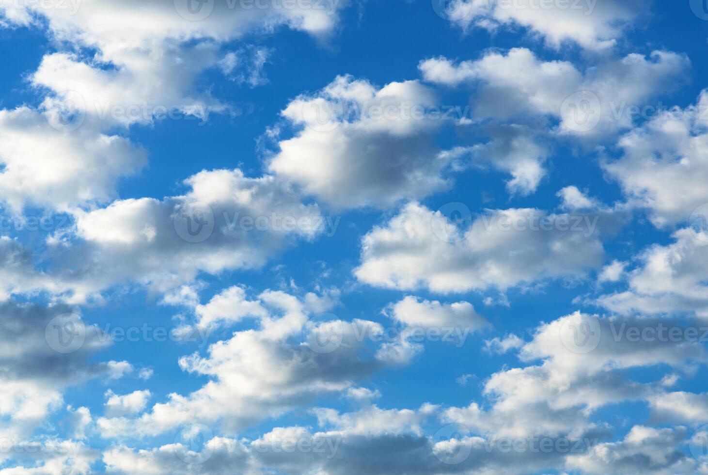 Small clouds against the blue sky photo