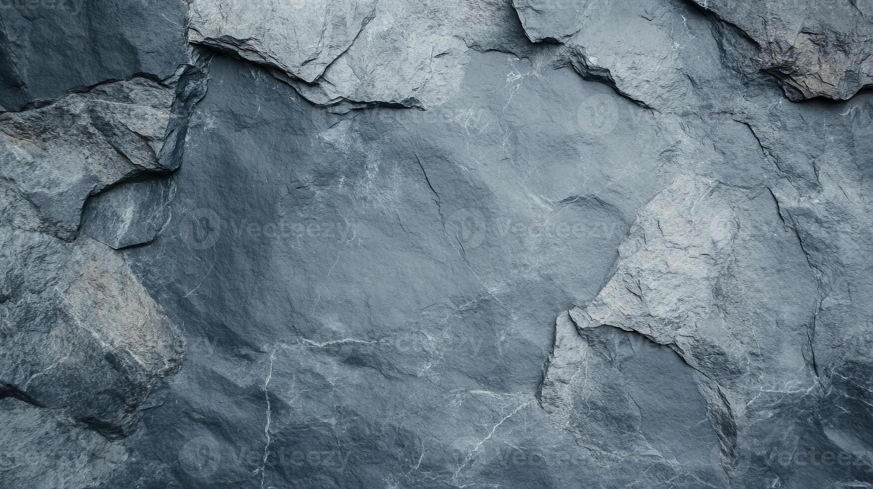Close-up view of textured grey stone surface showcasing natural formations and lines. Ideal for backgrounds, design concepts, or architectural studies requiring earthy, rugged textures. photo