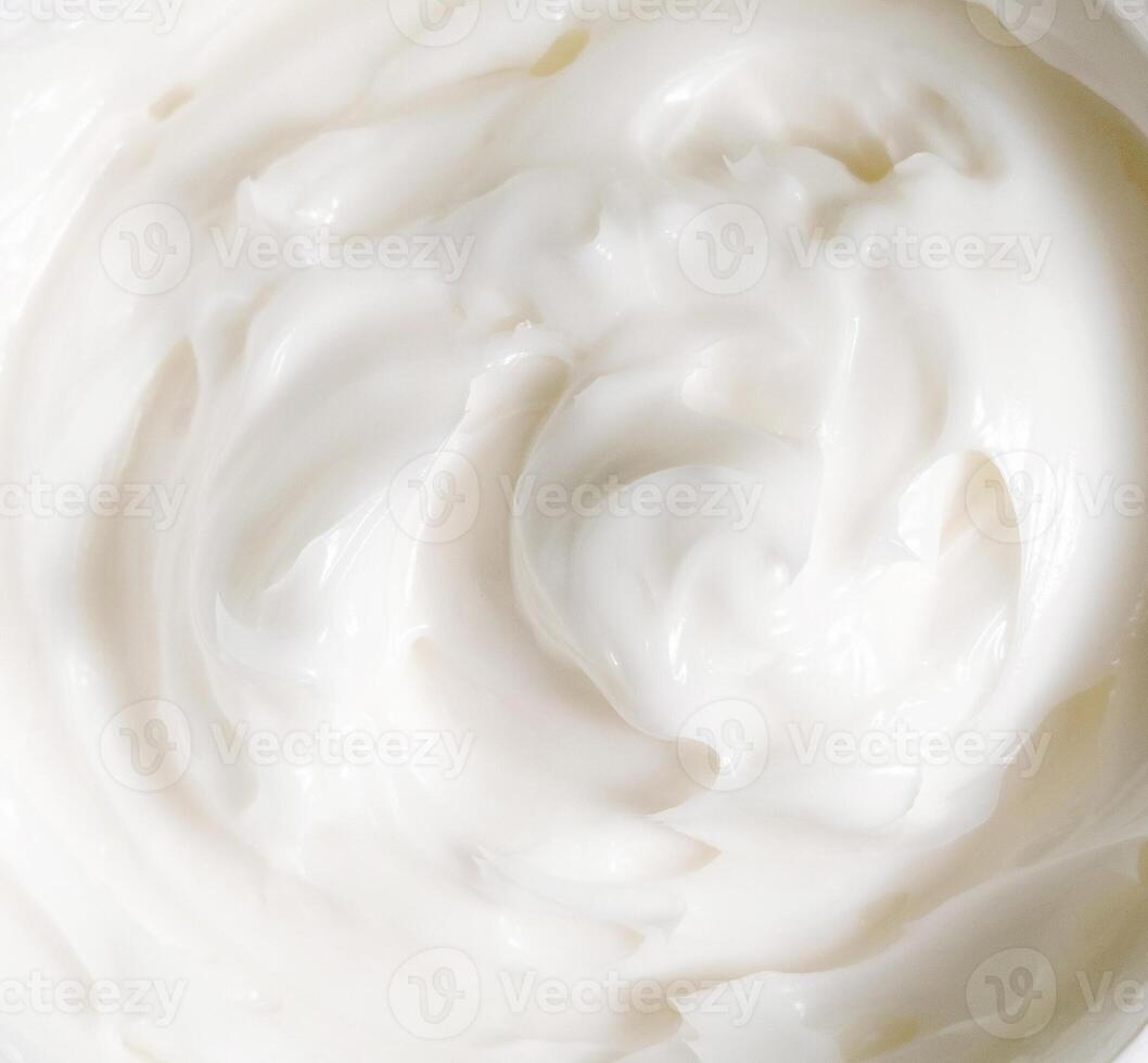Texture of white face or body cream top view, Lotion in Opened cosmetic Container photo