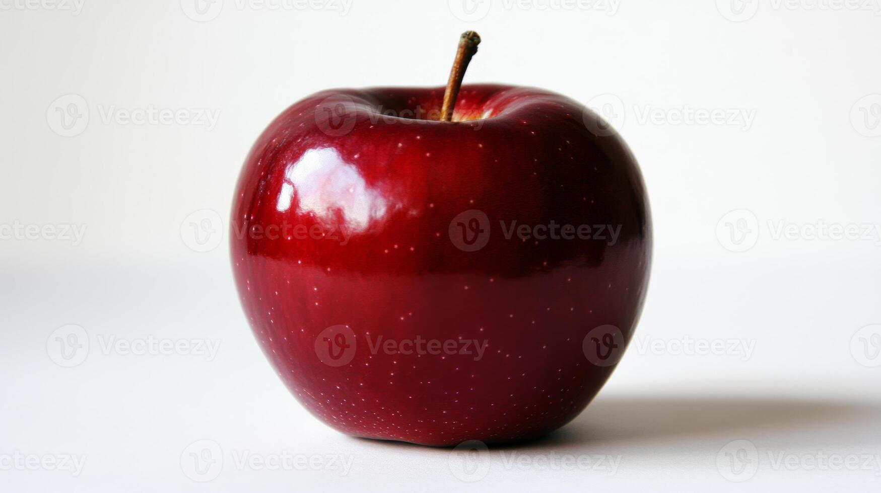 Glossy red apple resting on white surface, casting soft reflections and revealing smooth contours, symbolizing fresh, vibrant nutrition photo