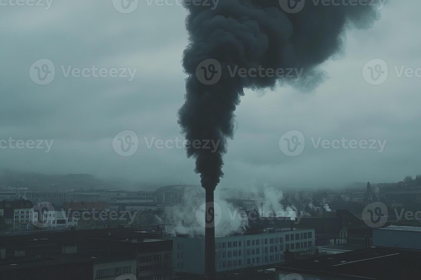 Dramatic photo of thick black smoke billowing from factory chimney under moody overcast sky and urban background. themes of air pollution, environmental crisis, industrial impact