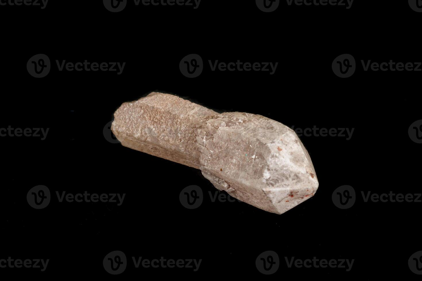 Macro of a stone, a scepter-like quartz mineral on a black background photo