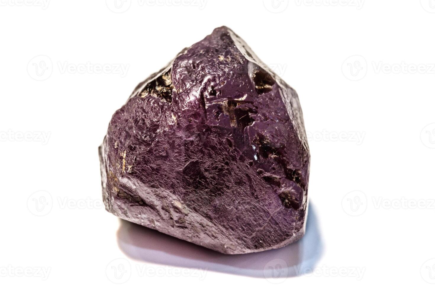 Macro of Alexandrite mineral stone in rock on white background photo