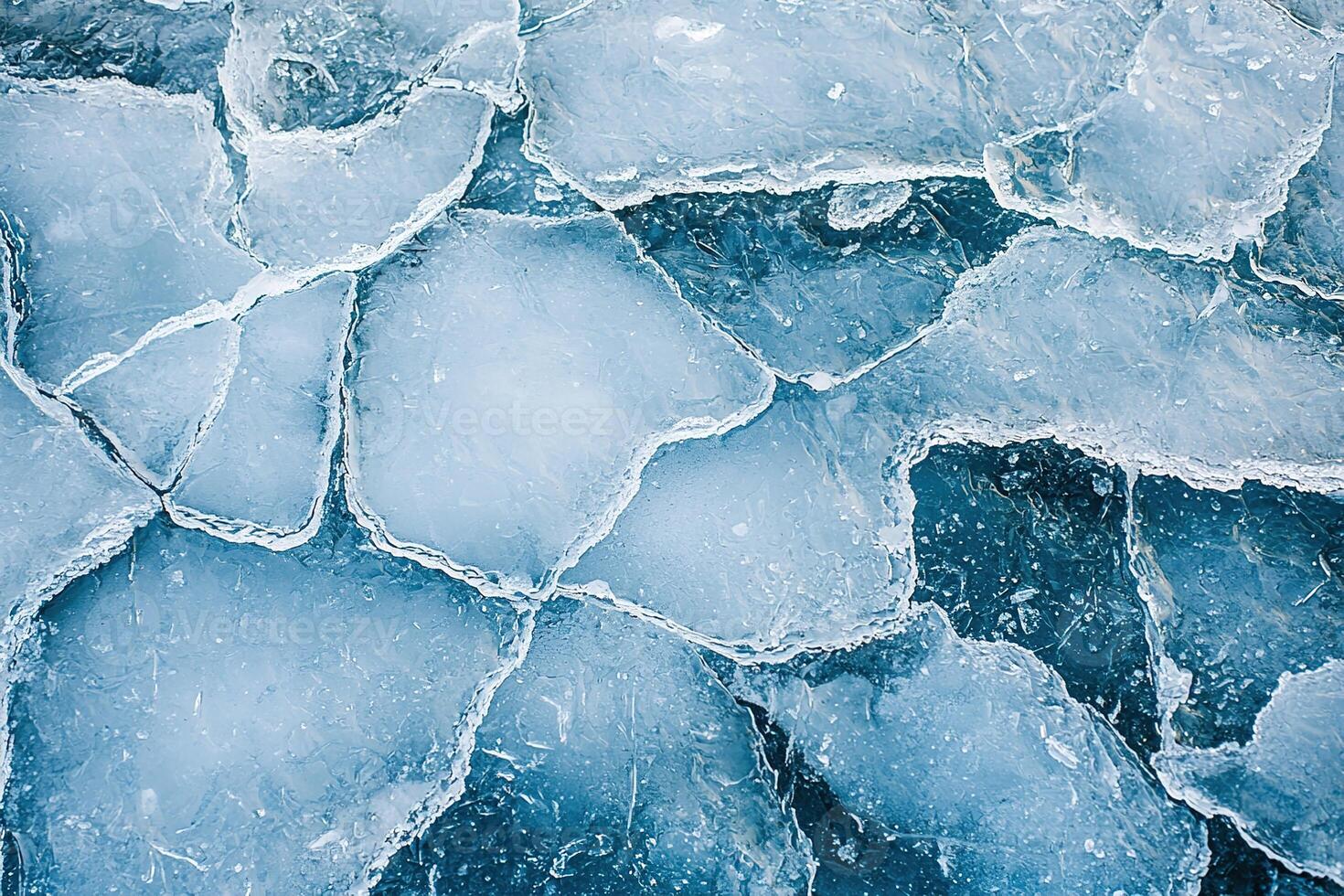 Artistic overhead view of ice textures with organic fractures and abstract lines, creating serene, frosty atmosphere in subtle blue hues photo
