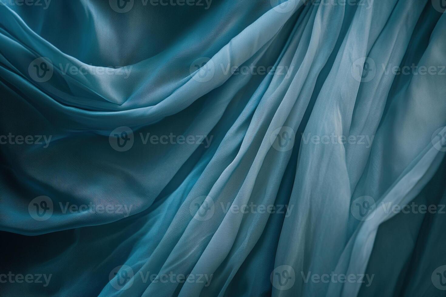 Elegant detailed view of flowing blue silk, its smooth surface catching soft highlights and shadows, perfect for backgrounds and luxury concepts photo