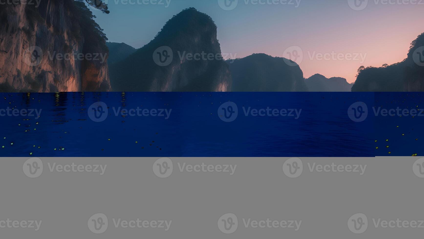 Mountains and Water at Dusk with Distant Lights Reflecting photo