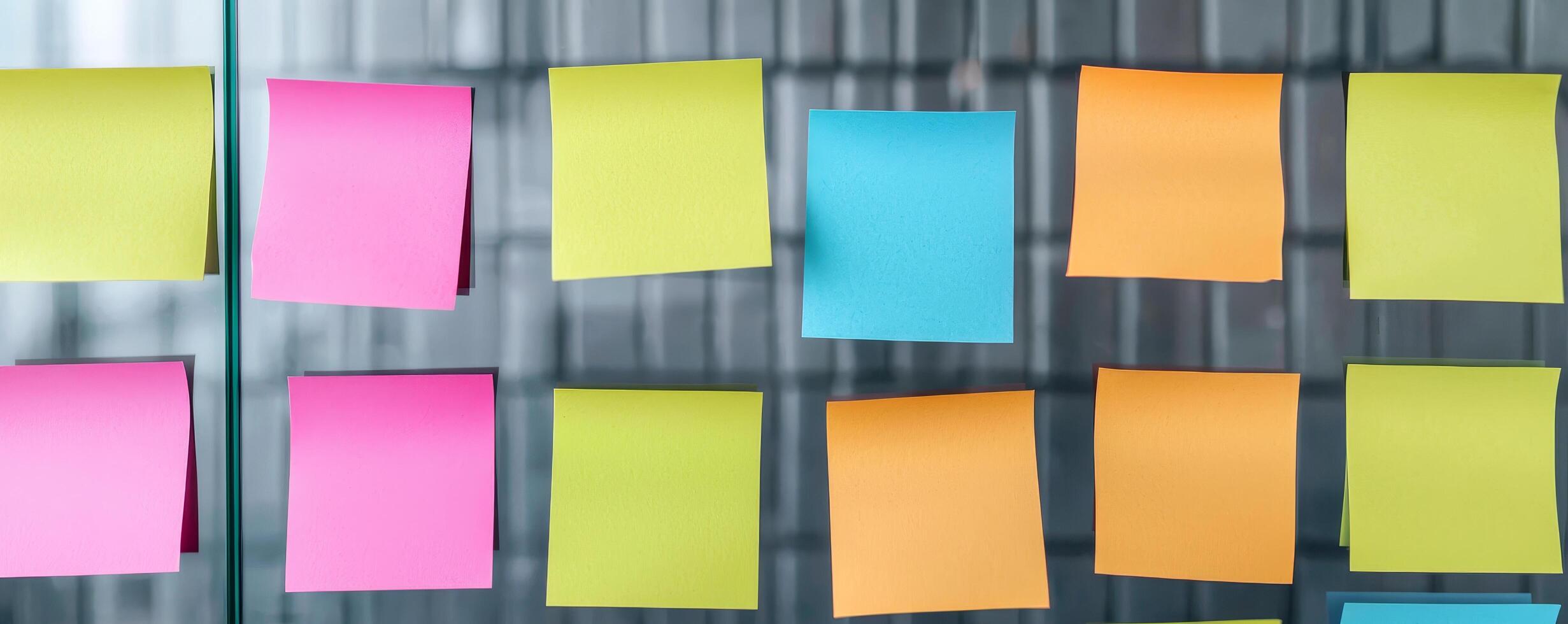 Colorful sticky notes arranged on a metallic surface. photo