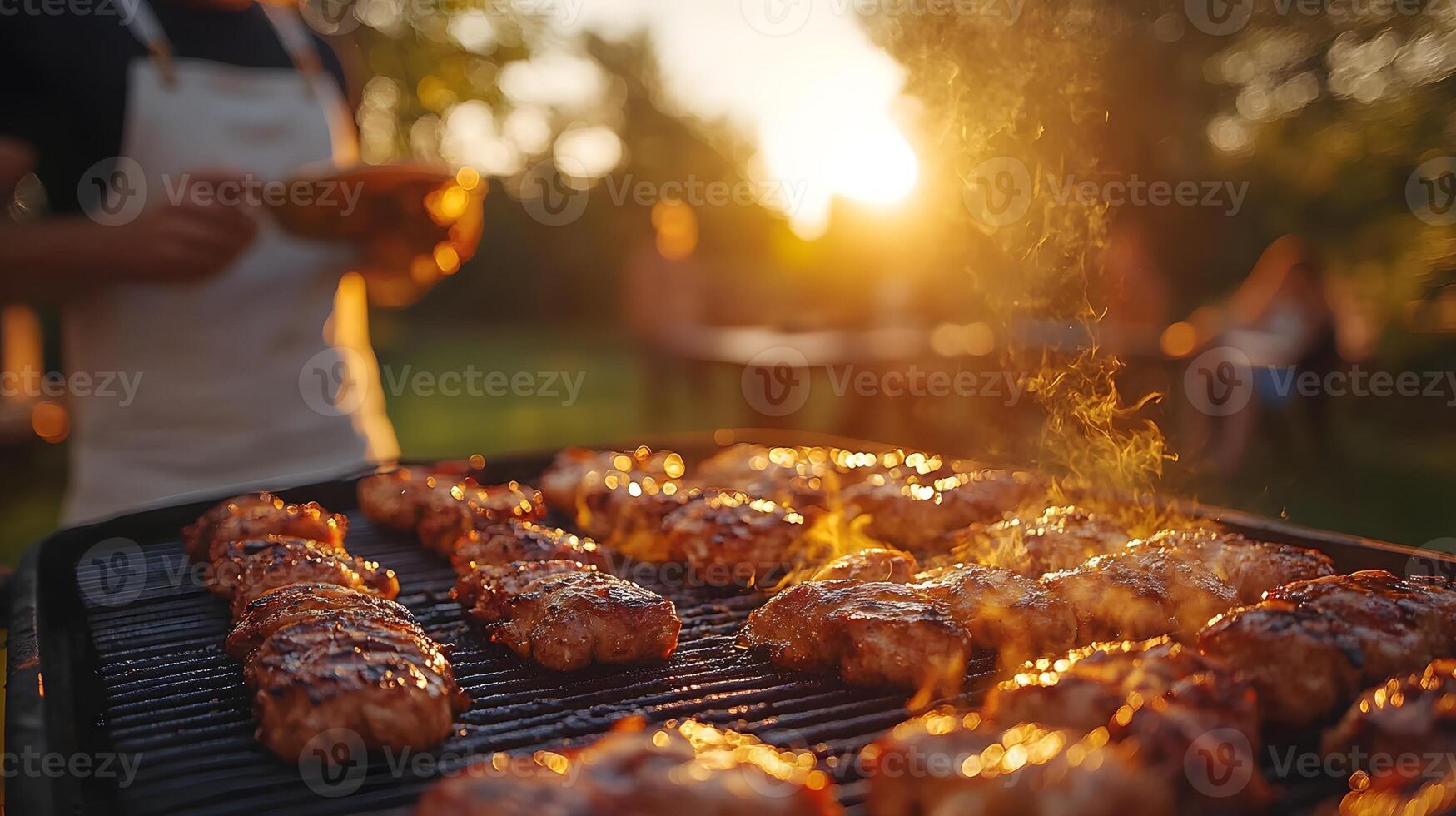 family cooking a barbecue on grill in the backyard, summer vibes photo