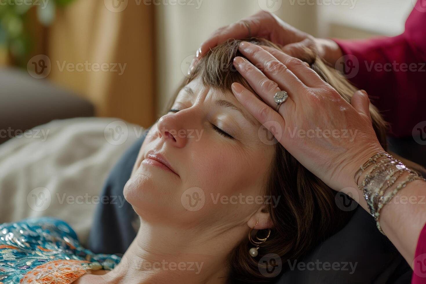 energy therapy session with practitioner using gentle hand movements on relaxed client photo