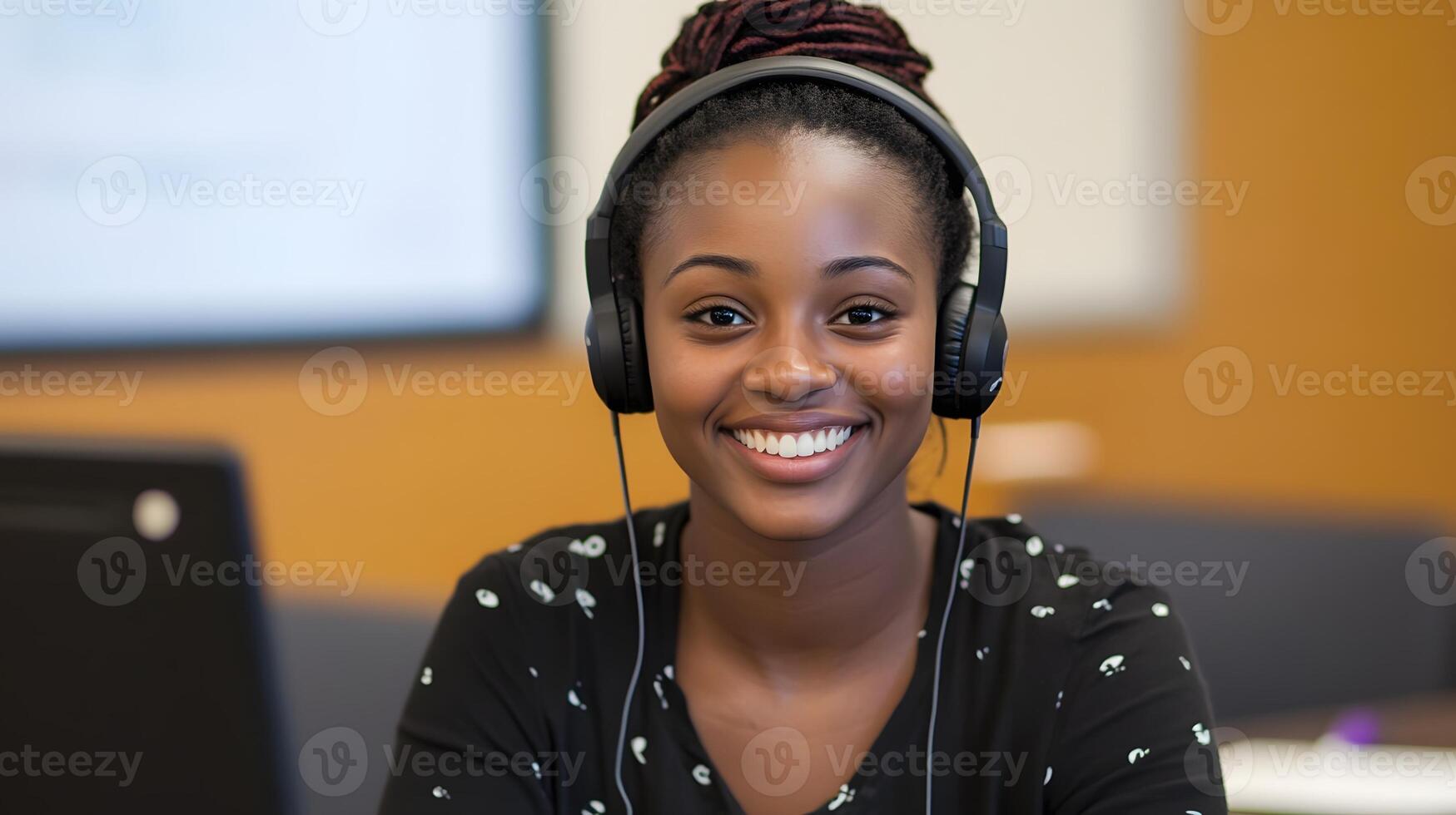 smiling female student answering question in virtual classroom with headphones and webcam photo
