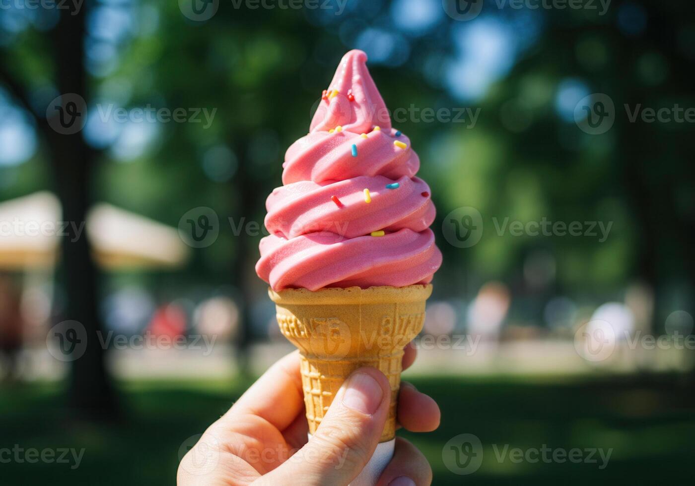 A refreshing swirl of pink ice cream in a crispy cone, perfect for a sunny day. photo
