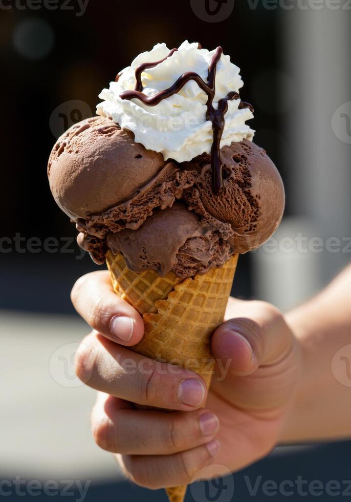 A refreshing double scoop of chocolate ice cream in a waffle cone, perfect for a summer day. photo