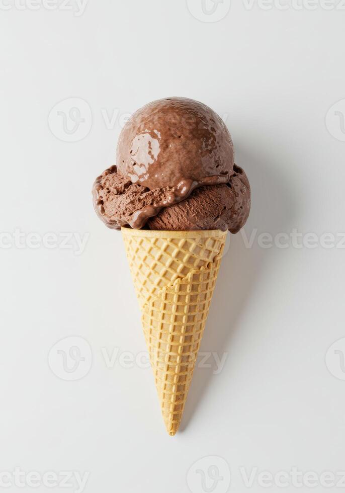A single chocolate ice cream scoop on a waffle cone isolated on a white surface. photo
