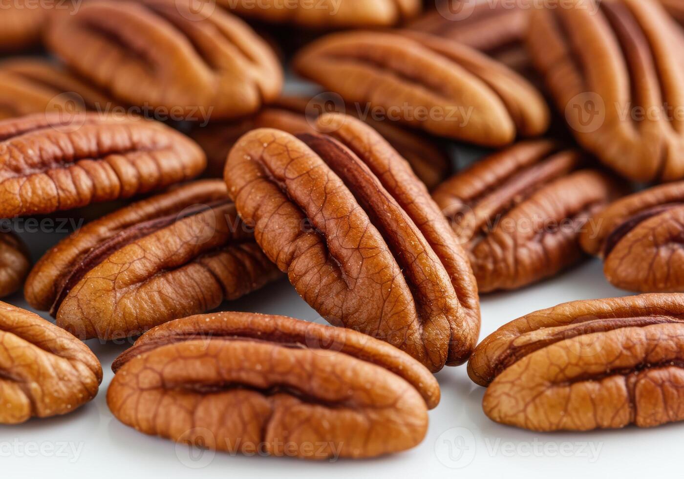 A close-up shot of delicious shelled pecans, perfect for snacks and culinary uses. photo