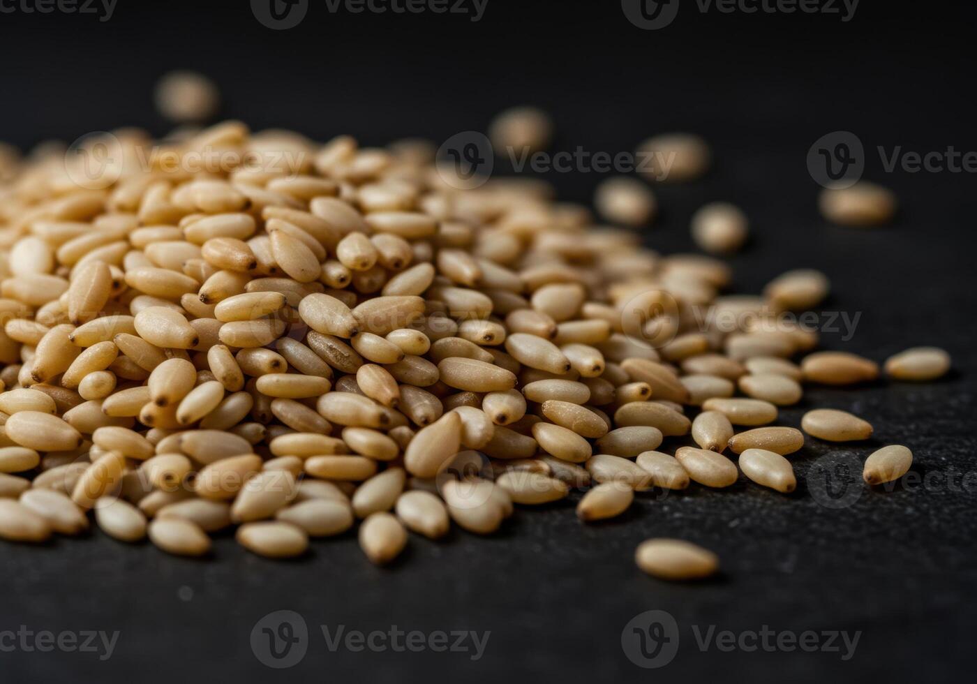 Close up shot of a pile of toasted sesame seeds, perfect for cooking and flavoring. photo