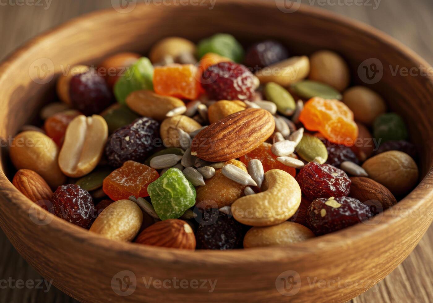 A beautifully arranged wooden bowl filled with a delicious mix of nuts and dried fruits. photo
