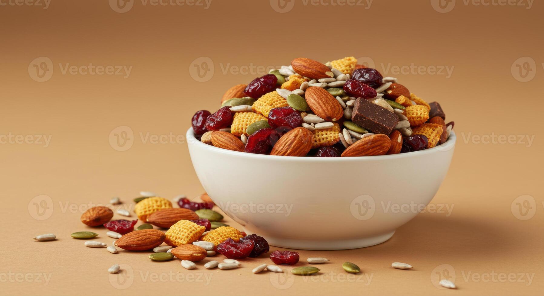 A delicious bowl of mixed trail mix with almonds, seeds, cranberries, and chocolate. photo