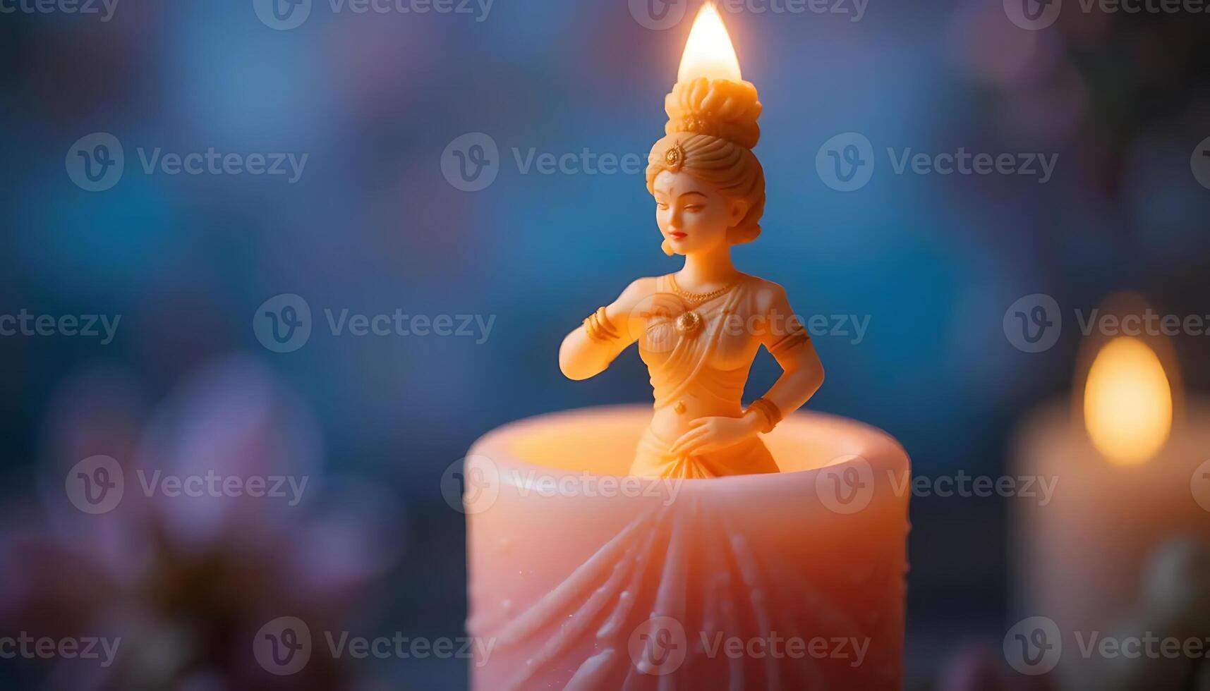 Elegant candle featuring a woman figurine emitting a soft glow, creating a serene atmosphere with blurred background and gentle lighting, perfect for meditation and relaxation. photo