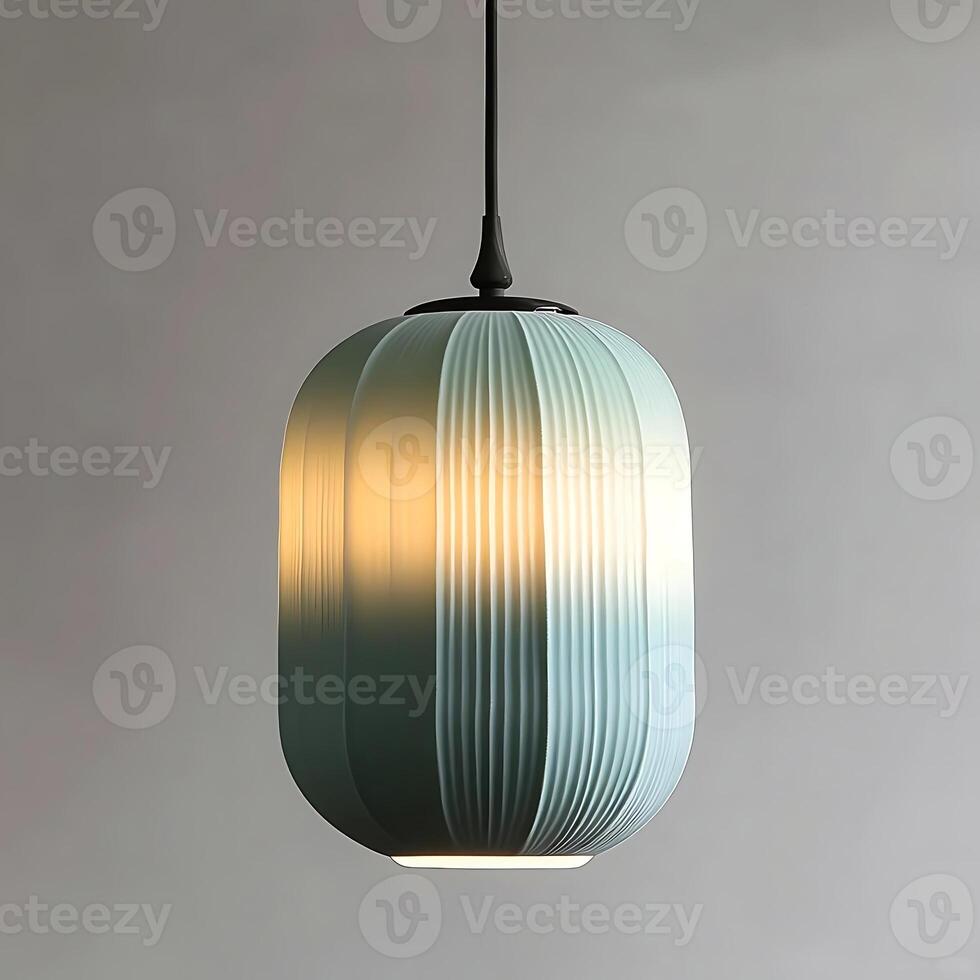 Elegant blue pendant light casting soft light with fluted design, creating a warm ambiance and modern aesthetic suspended from the ceiling photo