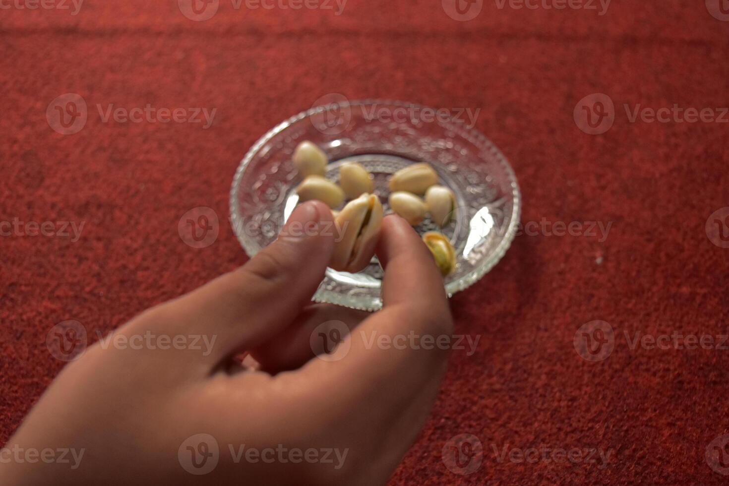 Pistachio nuts or Pistacia vera, a cashew-related seed that can be eaten fresh or roasted and is commonly used in a variety of desserts. photo