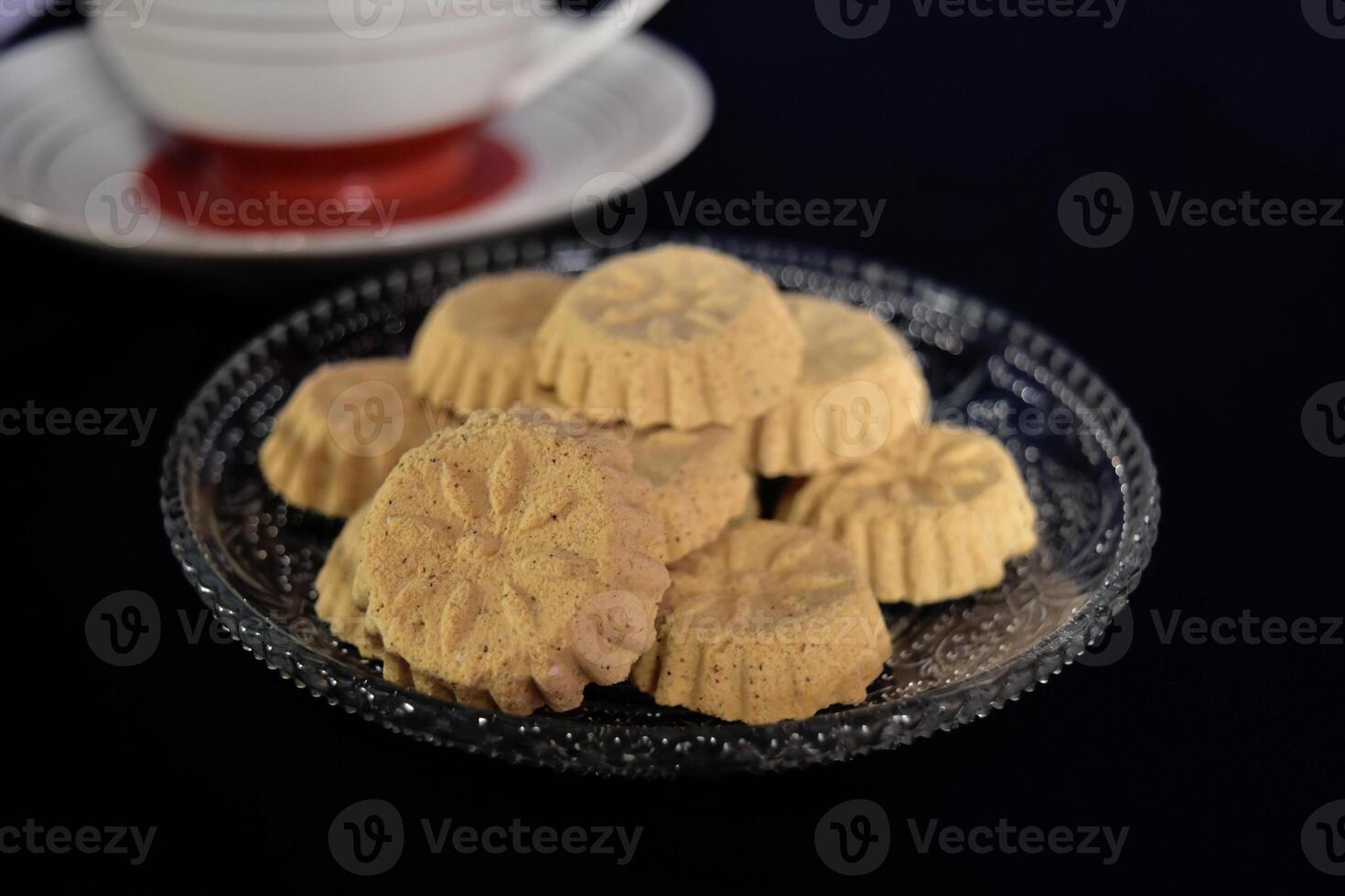 Close up view of kue satu or kue koya, a popular dry traditional cookie commonly found in Java, made of sweet mung bean powder that crumbles when bitten. photo