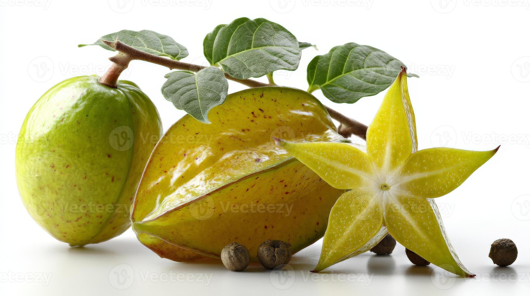 Closeup of Ripe Yellow Starfruit with Green Leaves and Black Peppercorns on White Background photo